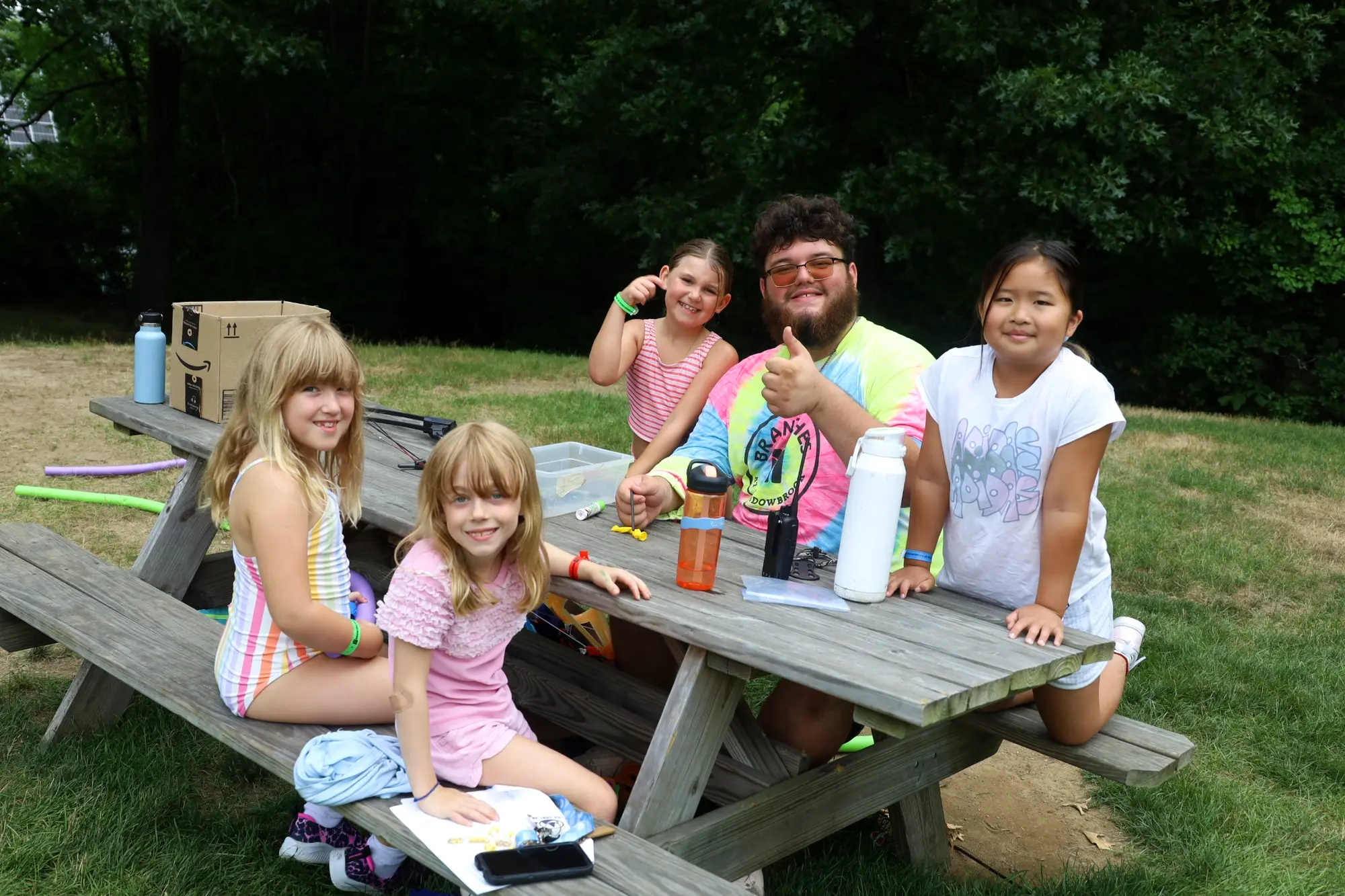 Campers and a counselor sharing an outdoor activity together