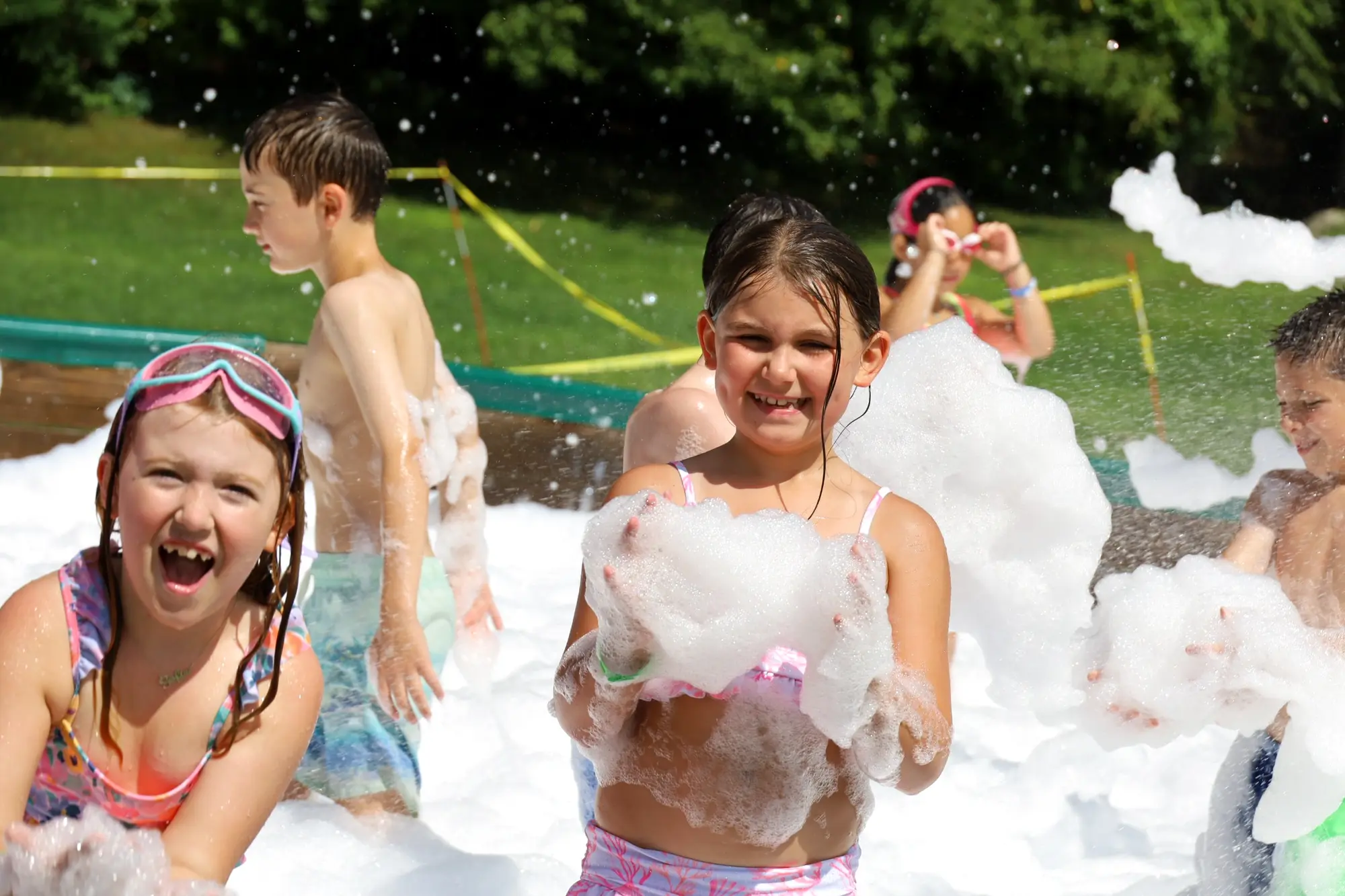 Children enjoying a water activity at camp