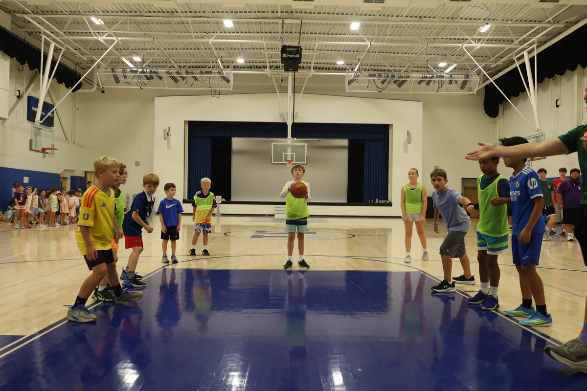 Adventurers playing basketball in the Meadowbrook gym